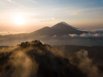 Scenic view of mountains against sky during sunset