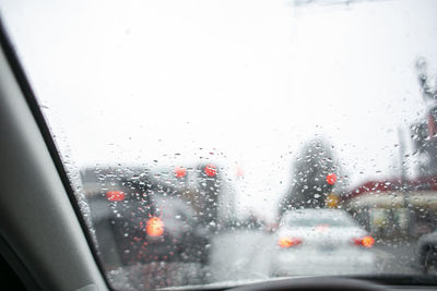 City seen through wet glass window