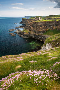 Scenic view of sea and rocks against sky