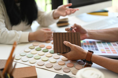 Midsection of woman holding toy blocks