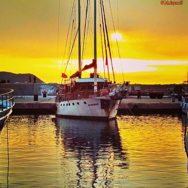 sunset, water, nautical vessel, boat, transportation, orange color, sea, mode of transport, sky, scenics, reflection, moored, beauty in nature, sun, waterfront, tranquility, tranquil scene, sailboat, idyllic, nature