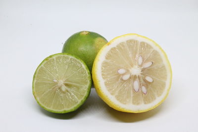 Close-up of lemon slice against white background
