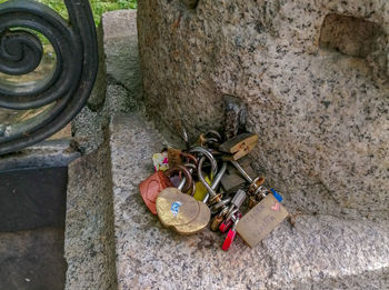 High angle view of padlocks on rock