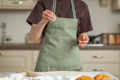 Midsection of woman holding food