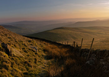 Scenic view of landscape against sky during sunset