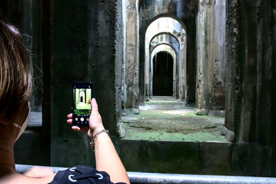 Portrait of woman photographing at camera