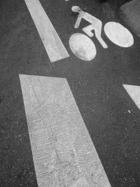 High angle view of arrow symbol on road