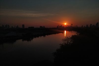 Scenic view of sunset over city