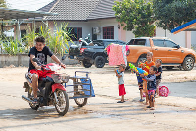 Man riding motorcycle on street in city