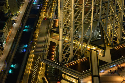 Low angle view of illuminated bridge at night