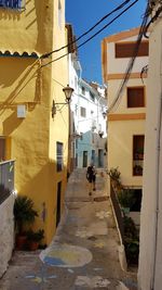 Footpath amidst buildings in town