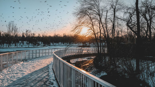 Scenic view of lake against sky during winter