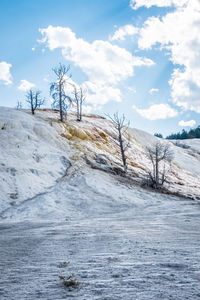 Scenic view of land against sky during winter