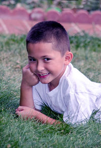 Close up portrait of a smiling boy outdoors