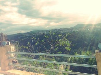 Scenic view of landscape against cloudy sky