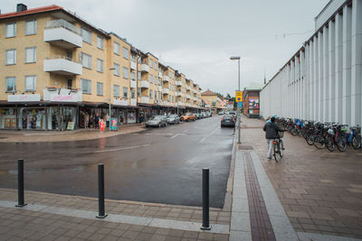 People in city against sky