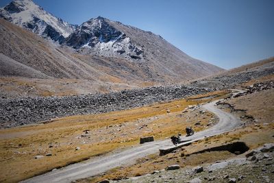 Scenic view of mountains against clear blue sky