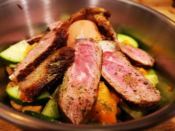 Close-up of dog food duck breast with asparagus 