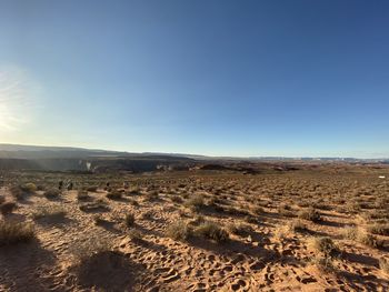 Scenic view of desert against clear sky