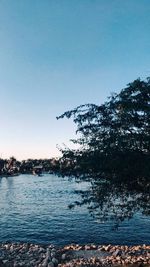 Scenic view of lake against clear blue sky