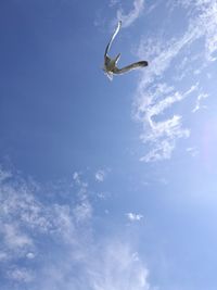 Low angle view of helicopter flying in sky