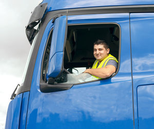 Low angle view of a man  in car