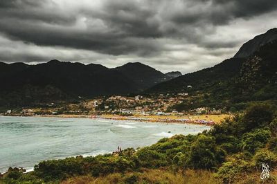 View of beach against cloudy sky