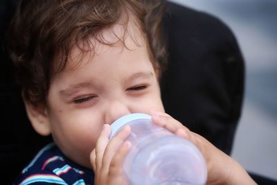 Close-up of baby boy drinking milk