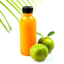 Close-up of green fruits on table against white background