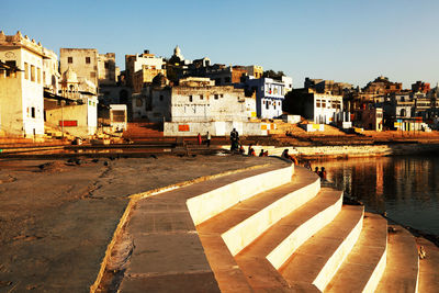 Buildings and steps by lake