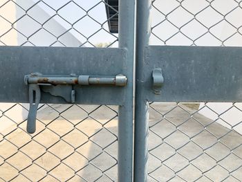 Close-up of closed metal gate