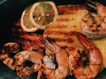 Close-up of roasted seafood with fruits