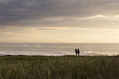 Scenic view of sea against cloudy sky