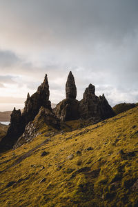 Rock formations on landscape against sky