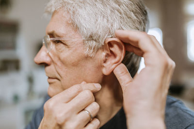 Senior man with hearing aid