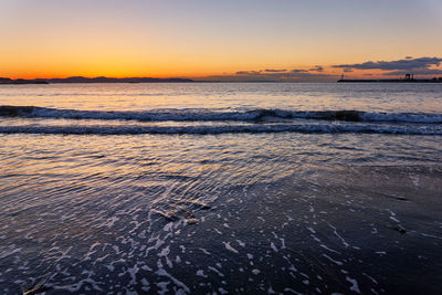 Scenic view of sea against sky during sunrise