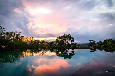 Scenic view of lake against sky during sunset