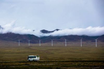 Scenic view of landscape against cloudy sky