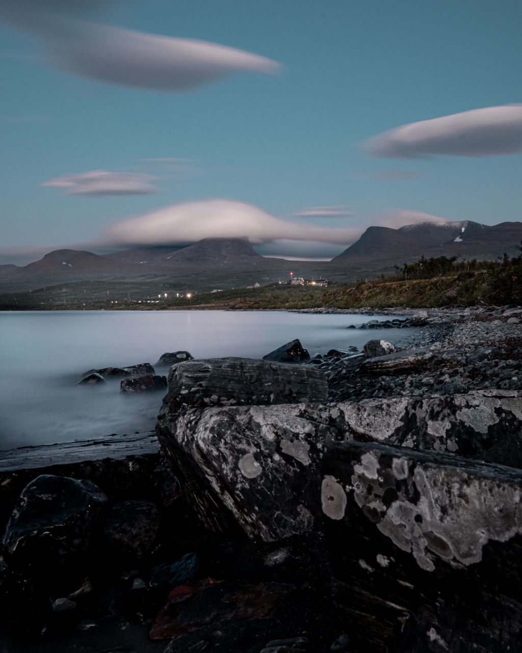 SCENIC VIEW OF SEA AND ROCKS AGAINST SKY