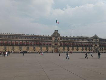 Group of people in front of historical building