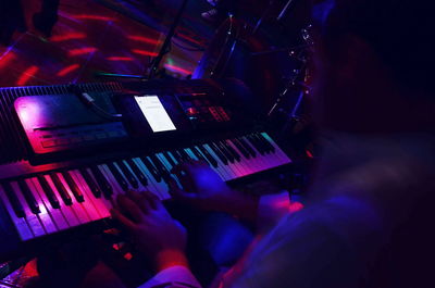 Low angle view of man playing piano