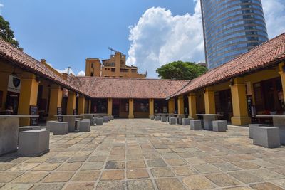 Street amidst buildings against sky