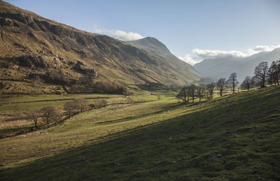 Scenic view of landscape and mountains against sky