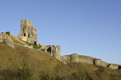 Low angle view of fort against blue sky