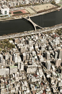 High angle view of river amidst buildings in city