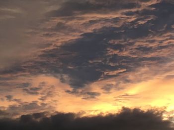 Low angle view of dramatic sky during sunset