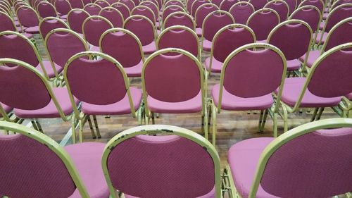 High angle view of empty chairs in stadium