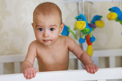 Portrait of cute baby boy at home