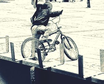 Man with bicycle on street