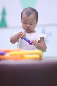 Close-up of boy playing with toys